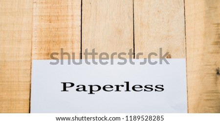  the text Paperless in a concept image on wooden background