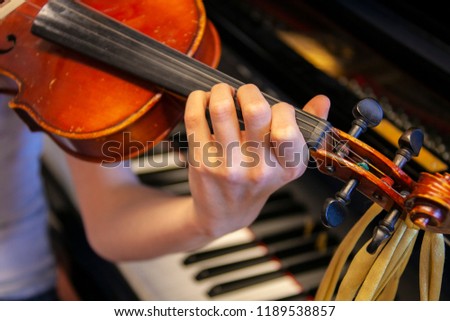 close-up of girl playing violin