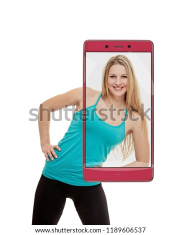 Taking picture of young smiling sporty woman training. conceptual collage with device