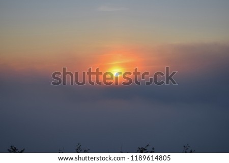 sun, sunrise with dense fog and blue sky background at dawn