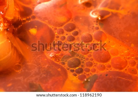 background of the oil in a soup. macro