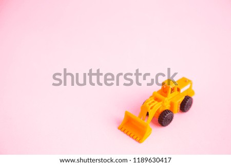 construction shovel toy in colorful background