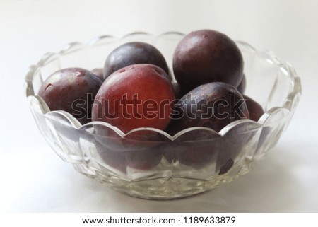 plums in a vase