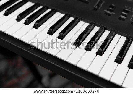 Synthesizer piano key board top view.Professional electronic midi keyboard with black and white keys.