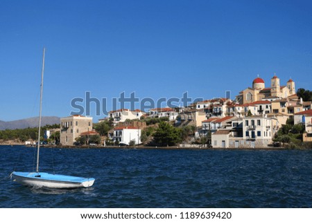 Photo from famous and picturesque port of traditional marine village of Galaxidi featuring iconic church of Agios Nikolaos, Fokida, Greece               