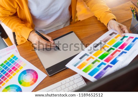 graphic designer working in her office