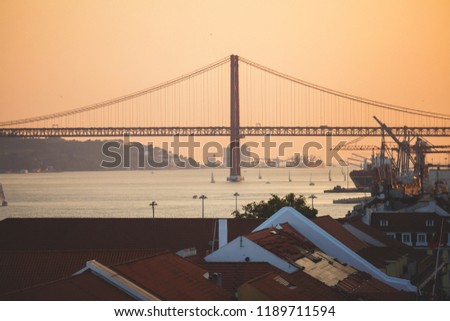Beautiful super wide-angle aerial view of Lisbon, Portugal with harbor and skyline scenery beyond the city, shot from belvedere observation deck Rua Augusta Triumphal Arch Viewpoint, Commerce Square