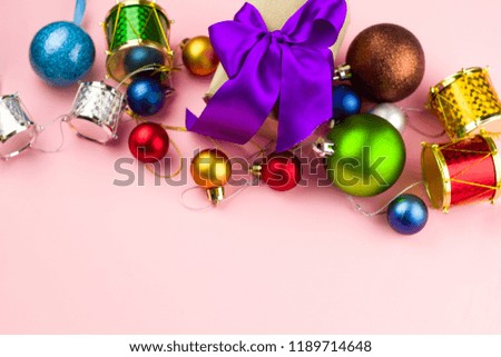 festive box with satin ribbon holiday decorative christmas toys top view  pastel pink background