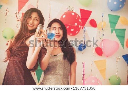 party time of beautiful women in evening dress drinking alcohol champagne celebrating new year, birthday, fun and happiness