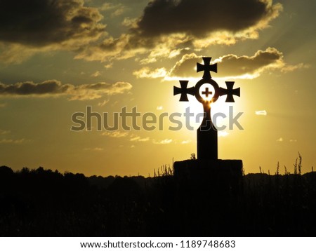 Beautiful Colorful Sunset Over Special Cross with Crosses Inside It