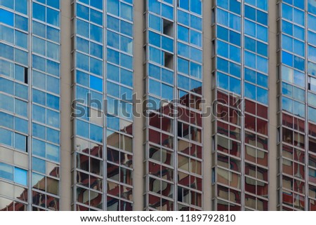 Abstract architectural detail of the windows of a tall building