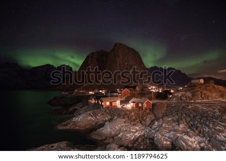 Fisherman village with northern light in the background. Travel for explore the Aurora. 