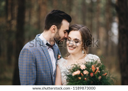 Happy bride and groom in the forest .  Autumn. The concept of a Rustic wedding style