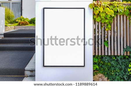 Blank Outdoor Advertisement Billboard Banner Sign With Black Frame On White Wall On Sunny Day.Beautiful Exterior Design.White Display Isolated Template Clipping Path Free Space Ad Mock Up