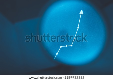 exponential diagram. growth statistics progress concept. arrow pointing up on blurred blue background Royalty-Free Stock Photo #1189932352
