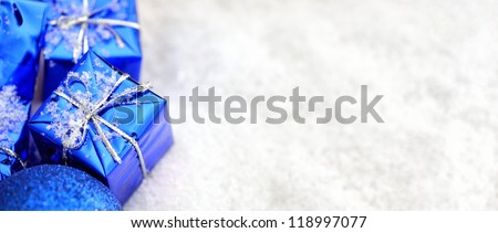 Blue Christmas gifts in the snow
