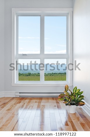 Empty room with beautiful view over field and mountains. Royalty-Free Stock Photo #118997122