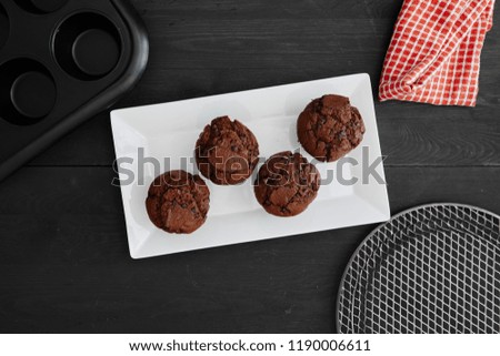 A studio photo of chocolate muffins