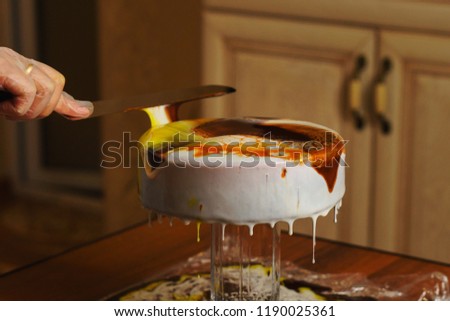 Cook preparing mousse cake Esterhazy. Girl fills dacquoise hazelnut almond hazelnut mousse. Home confectionery. Creating a pattern on glaze
