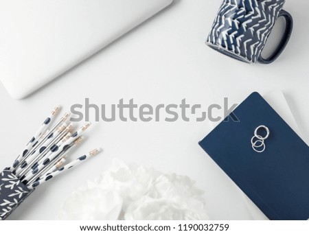 Navy blue and silver styled feminine office and desktop stock photos.