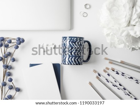 Navy blue and silver feminine styled office and desktop styled stock photos.