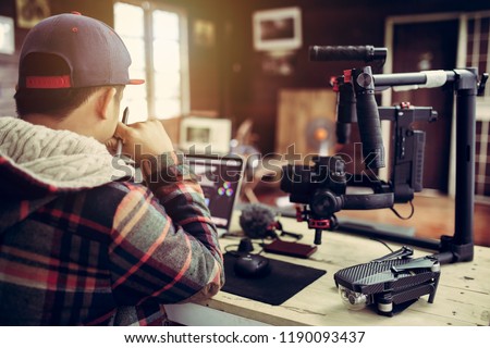 Vlogger editing video create content for upload on social media or internet online connect communication people ware. Royalty-Free Stock Photo #1190093437