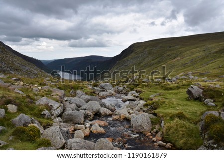 A beautiful irish mountain landscape with a lake in summer. Ireland mountains landscape scenic green scenery