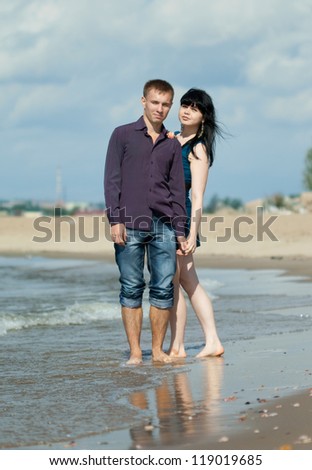 loving young couple is embracing at sea beach