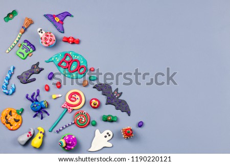 Halloween background with decorations. Black cat, bats, witches hat and broomstick with orange pumpkins on white background.
