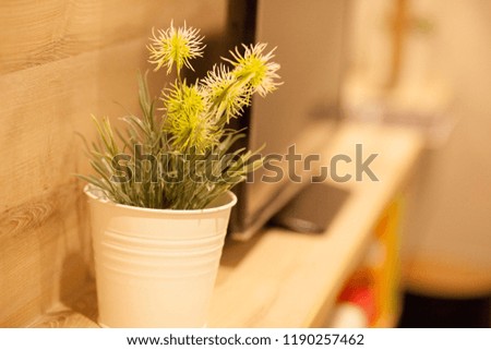 small artificial tree in a pot