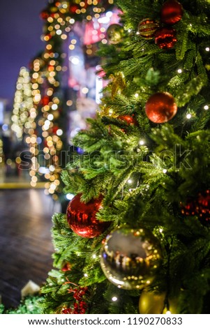 Photo of New Year decorated fir-trees on background of dark blue sky