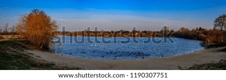"Biesdorfer Baggersee" ("Biesdorf Quarry Pond") in Berlin on an icy winter day - Panorama from 3 pictures
