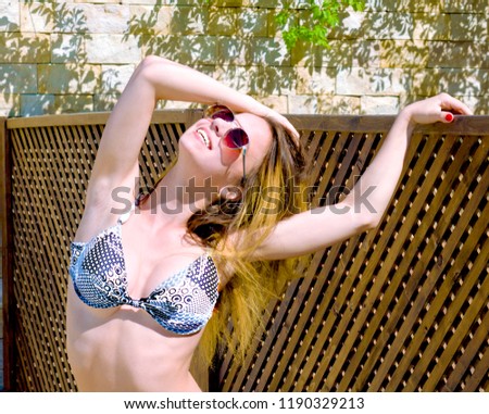 Happy smiling teenager with snow white teeth is wearing sunglasses, enjoying sea and having fun. Travel (vacation), adventure concept. Close up, outdoor.