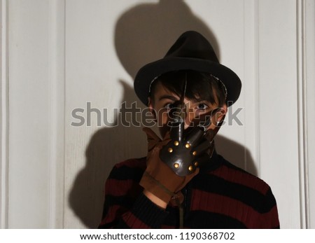 
 schoolboy posing in  costume playing role