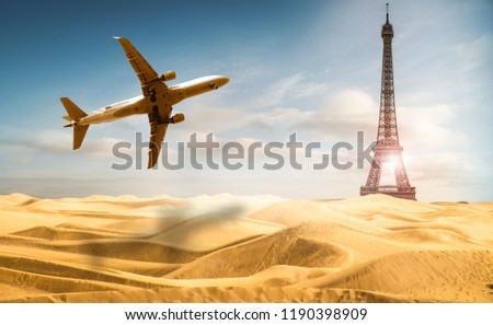 the Eiffel Tower in a desert with airplane