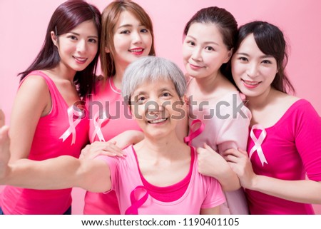 women selfie happily with breast cancer preventionon the pink background
