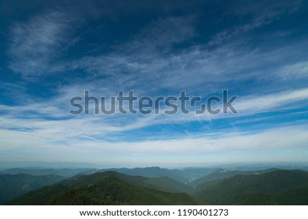 The picturesque mountain landscape on the background of clouds