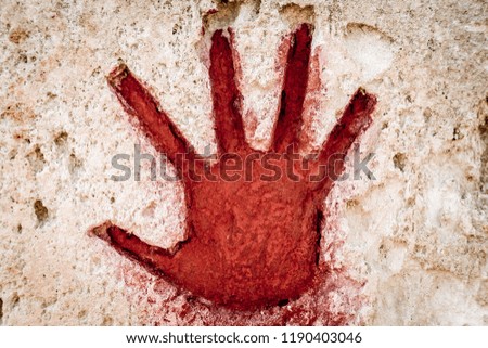 Young hand painted in red on stone - graphic gothic element