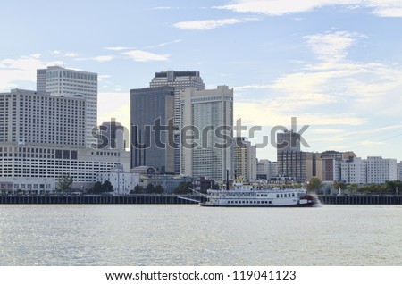 Skyline of New Orleans,  Louisiana. Paddlewheel steamboat in foreground.