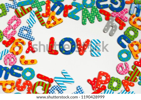 Love word surrounded by colorful letters