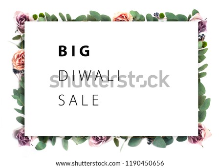 Big Diwali Sale.  Creative flower frame. White paper on the background of roses flowers and eucalyptus. A template for a poster, a brochure, a leaflet.
