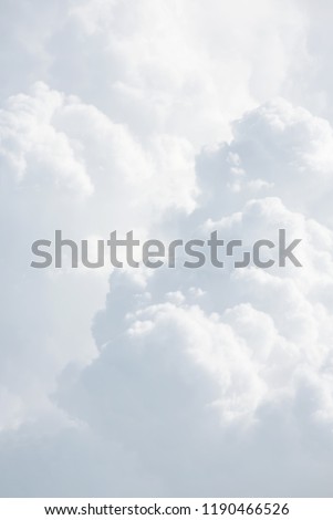Sky with clouds, a view from an aeroplane above the clouds. Abstract nature background with clouds in light tonality. White cumulus clouds Royalty-Free Stock Photo #1190466526