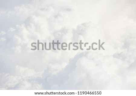 Sky with clouds, a view from an aeroplane above the clouds. Abstract nature background with clouds in light tonality. White cumulus clouds Royalty-Free Stock Photo #1190466550