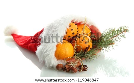 christmas composition with oranges and fir tree in Santa Claus hat, isolated on white