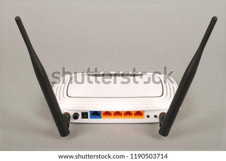 White WI-FI router with two antennas isolated on grey background