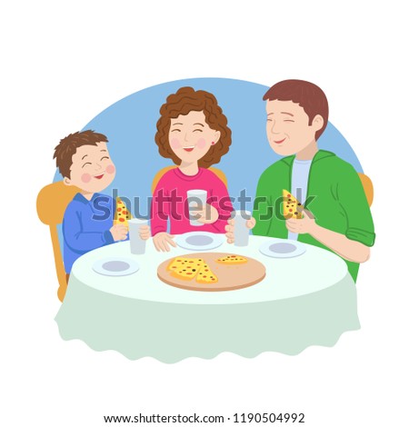Asian family is eating pizza at the table. Father, mother and son are laughing cheerfully.