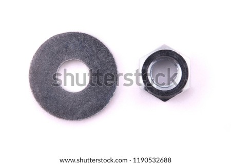 Flat metal washers and nut isolated on a white background