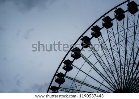 Ferris wheel cloudy day, shadow. 