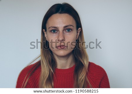 Woman with thick eyebrows. Blonde woman without make up. Young girl with blue eyes. No smile woman