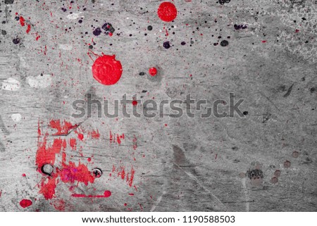old gray wall with spots of red paint Royalty-Free Stock Photo #1190588503